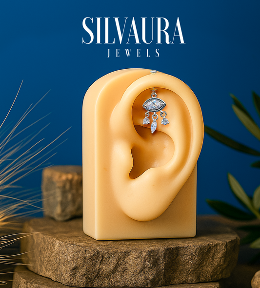 925 Sterling Silver Eye Motif Helix Earrings displayed on ear model by SILVAURA Jewels