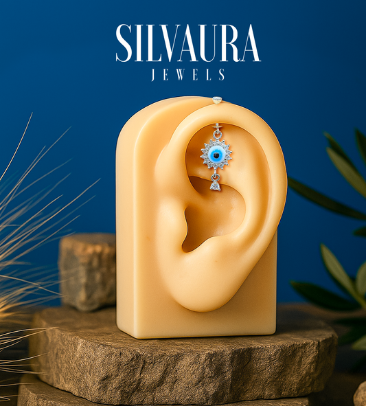 925 Sterling Silver Evil Eye Helix Earrings displayed on a realistic ear model by SILVAURA Jewels