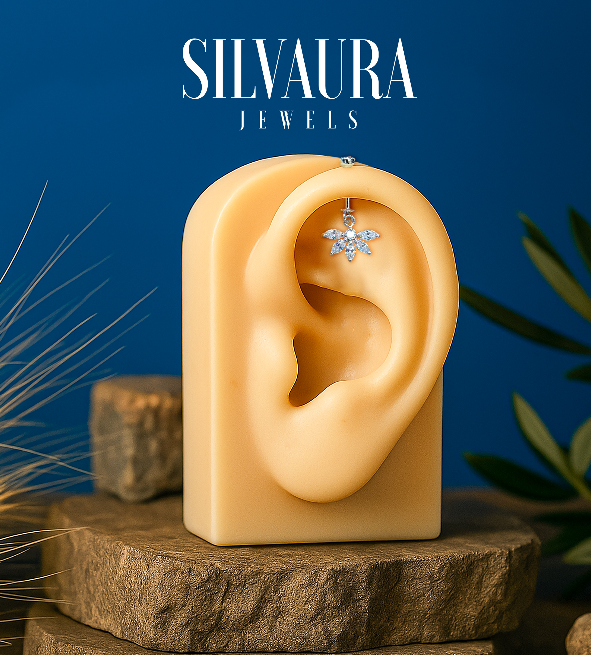 925 Sterling Silver Floral Helix Earrings displayed on a mannequin ear by SILVAURA with a blue background