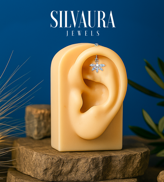 925 Sterling Silver Floral Helix Earrings displayed on a mannequin ear by SILVAURA with a blue background